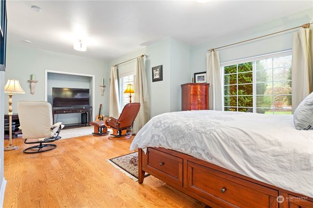 a bedroom with bed and window