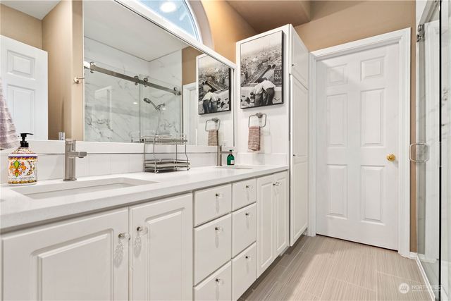 a bathroom with a sink and mirror