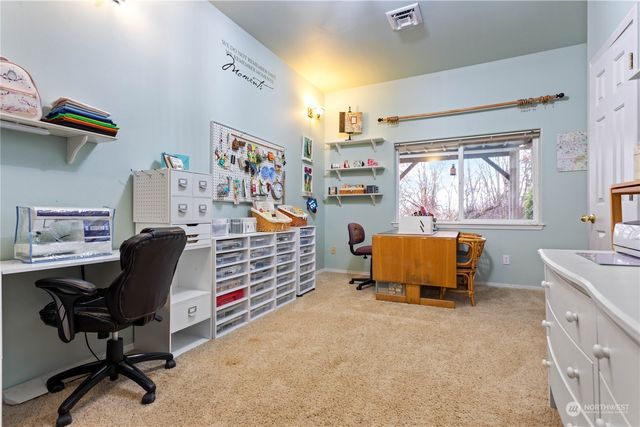 a bedroom with furniture and a window