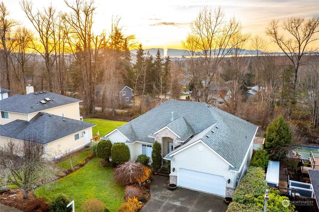 an aerial view of a house with a yard