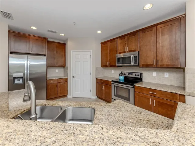 a dining room with furniture a patio and outdoor view