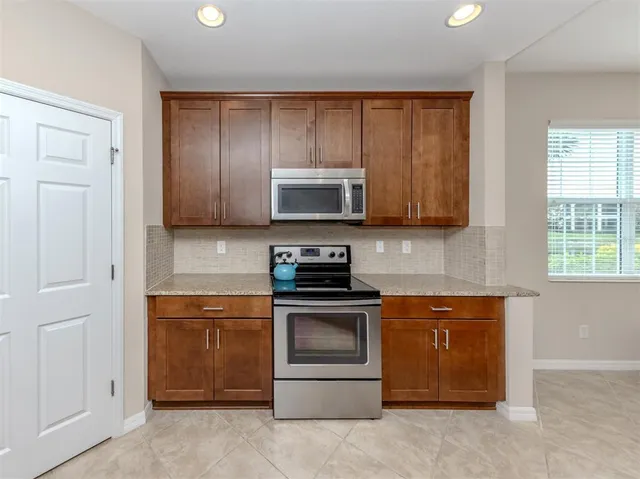 a bedroom with a bed and a table in it
