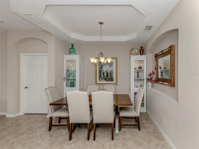 a kitchen with stainless steel appliances wooden cabinets a sink and a stove