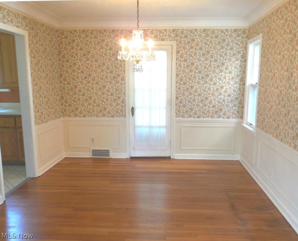 3597 Tullamore Road Cleveland, OH 44118 - Photo 9 of 20 Large dining room with recently refinished hardwood floors and a door that leads to a 2014 remodeled three season sun room.