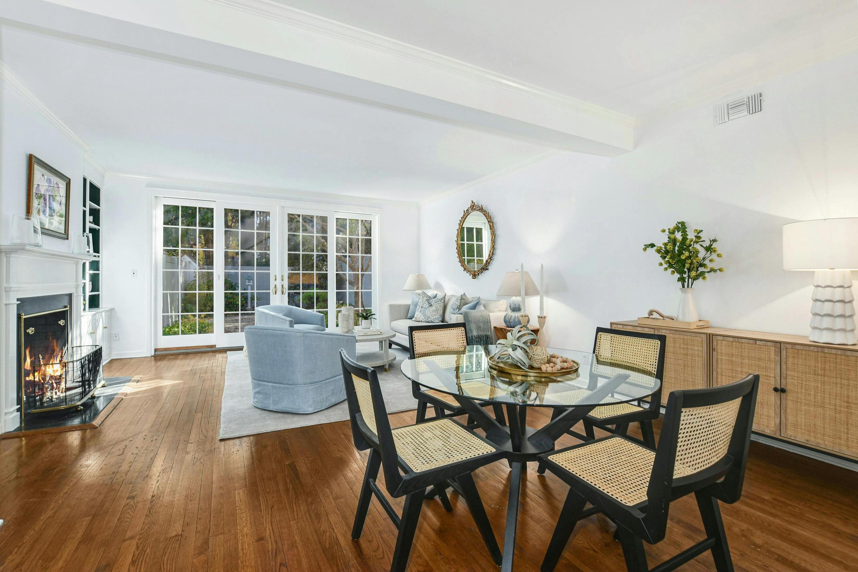 330 Elm Street, Unit 11 New Canaan, CT 06840 - Photo 1 of 26 a view of a dining room with furniture a fireplace and wooden floor