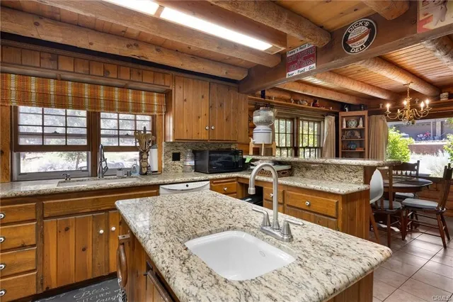 a kitchen with a stove and a sink