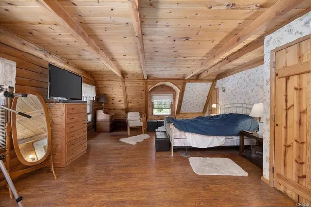 a bedroom with furniture and a window