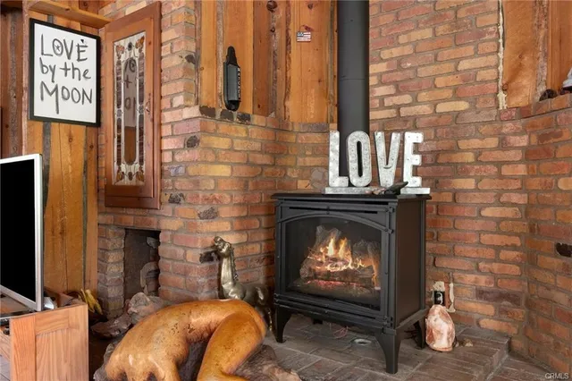 a fireplace with a clock on the wall
