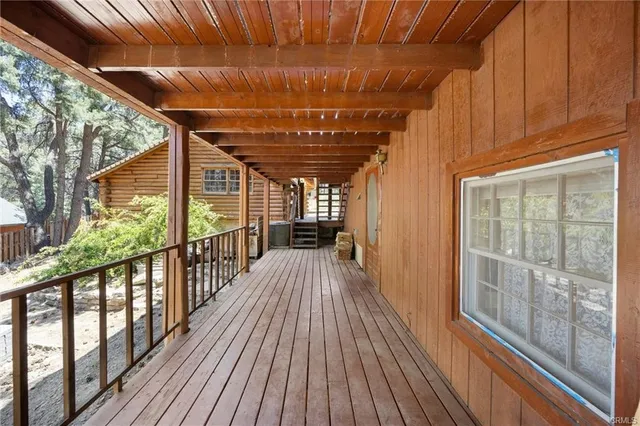 a view of a balcony with wooden floor