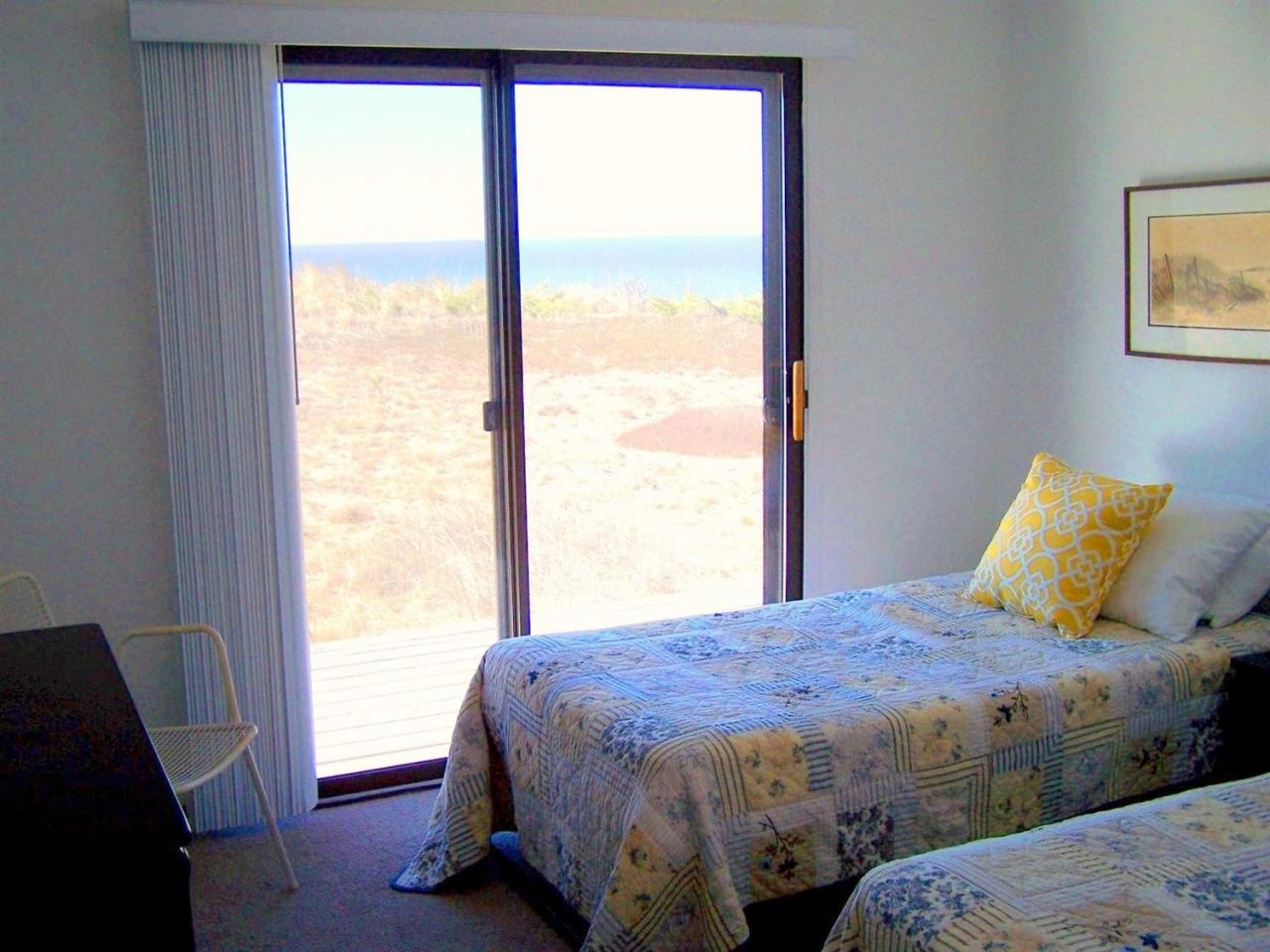 51 Fishermans Road Truro, MA 02666 - Photo 25 of 34 a bed sitting in a bedroom next to a window