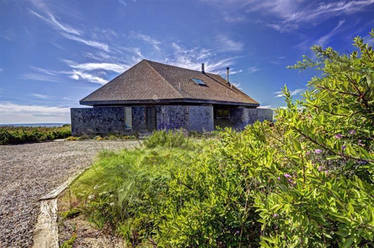 51 Fishermans Road Truro, MA 02666 - Photo 6 of 34 a front view of a house with garden