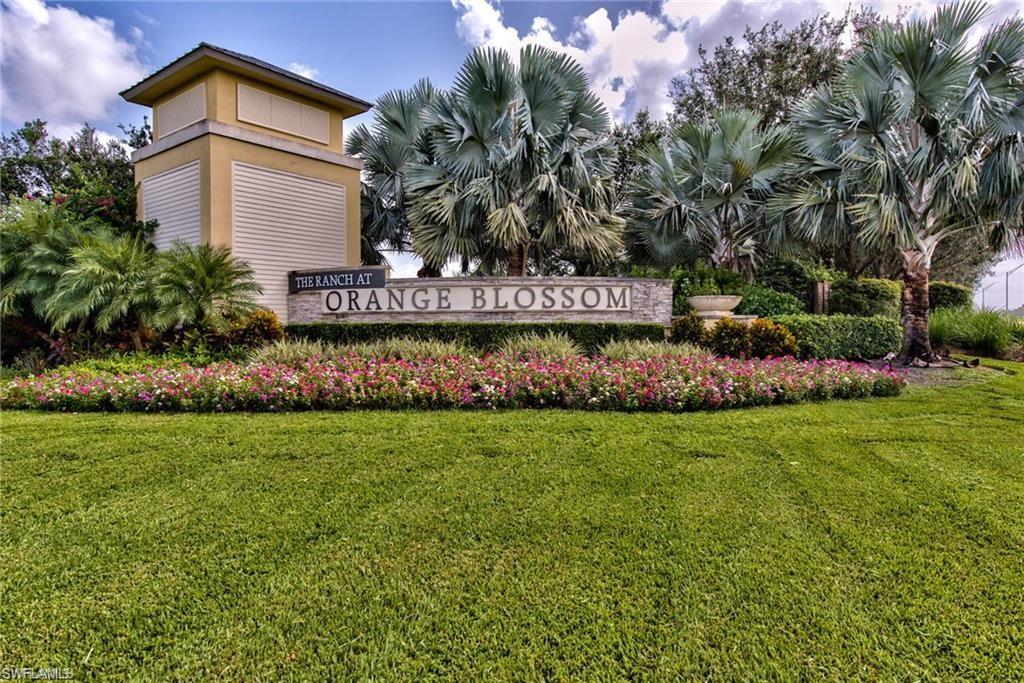 a front view of a house with a garden and yard