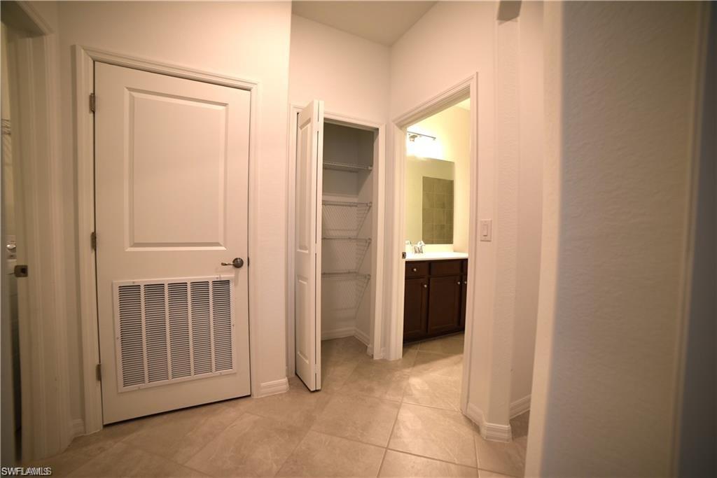 2665 Vine Avenue Naples, FL 34120 - Photo 11 of 30 a view of a hallway with an entryway door