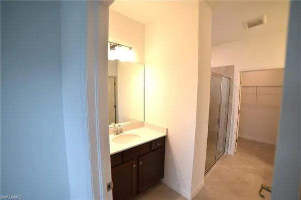 a view of a hallway with an entryway door