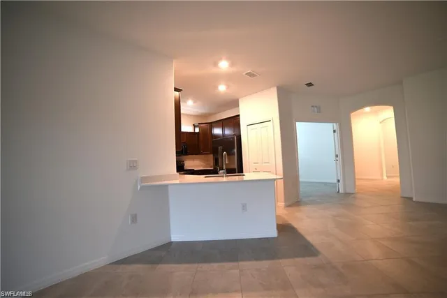 a view of a kitchen with a sink and a window