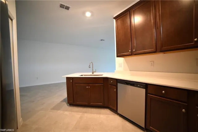a kitchen with a sink and cabinets