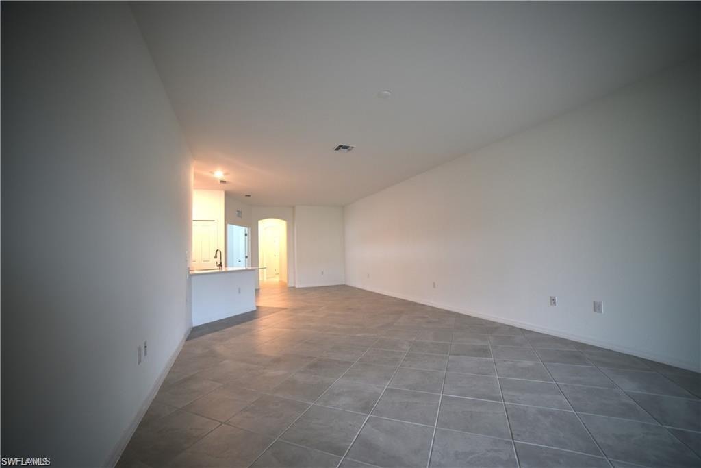 2665 Vine Avenue Naples, FL 34120 - Photo 4 of 30 a view of an empty room with a window