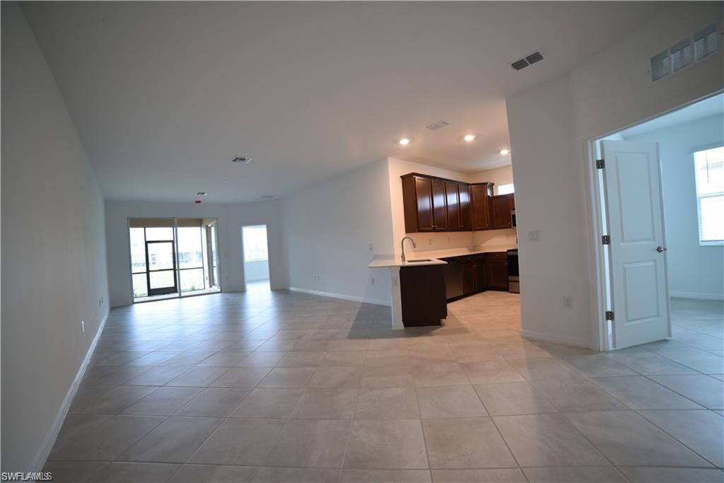 2665 Vine Avenue Naples, FL 34120 - Photo 30 of 30 an empty room with windows and cabinet