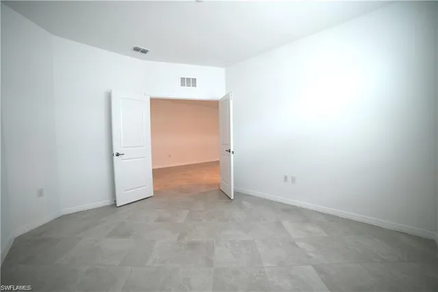 a view of a bathroom with a shower and a door