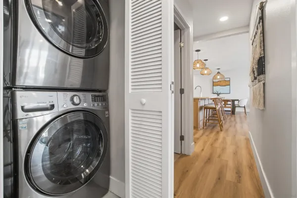 a view of a hallway with washer and dryer