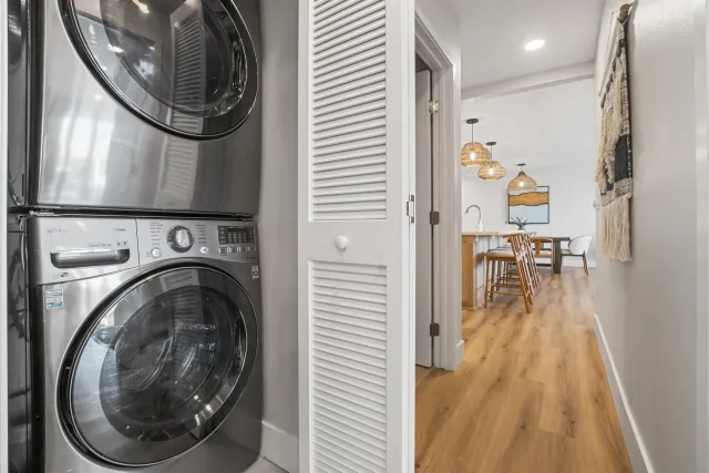 a view of a hallway with washer and dryer