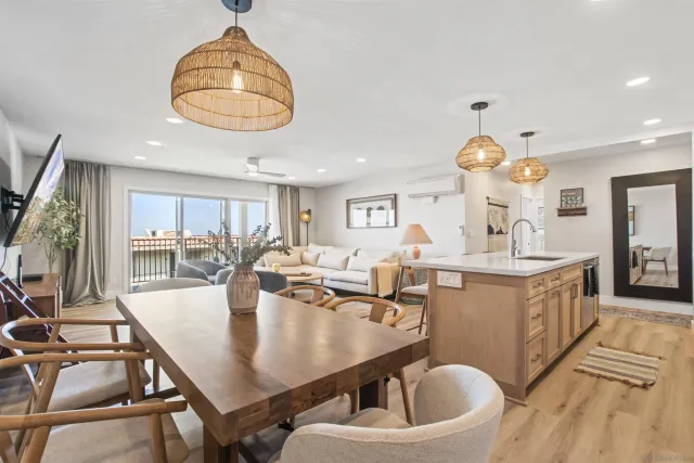 a very nice looking dining room with a table and chairs