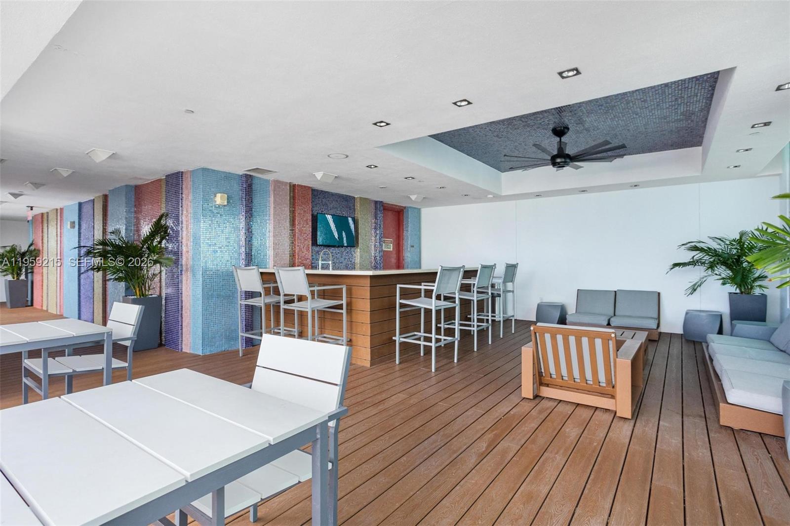 500 Brickell Avenue, Unit 1903 Miami, FL 33131 - Photo 14 of 18 a living room with furniture and a wooden floor