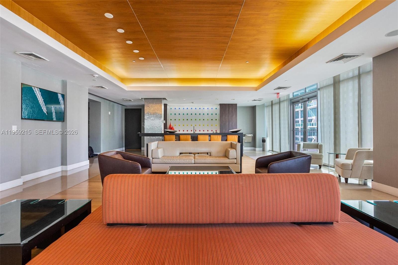 500 Brickell Avenue, Unit 1903 Miami, FL 33131 - Photo 18 of 18 a living room with furniture and a flat screen tv