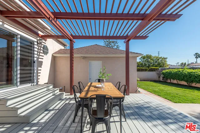 a patio with table and chairs