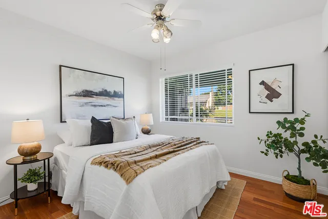 a bedroom with bed and a window