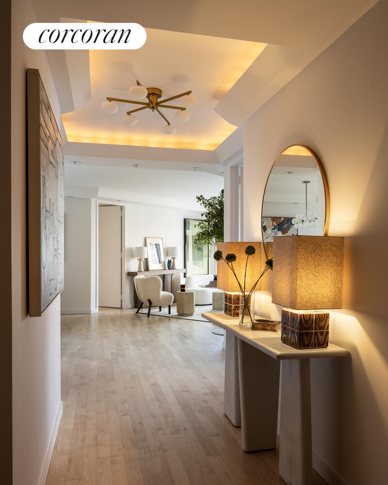 146 West 57th Street, Unit 58A Manhattan, NY 10019 - Photo 2 of 18 a view of living room with furniture and a fireplace