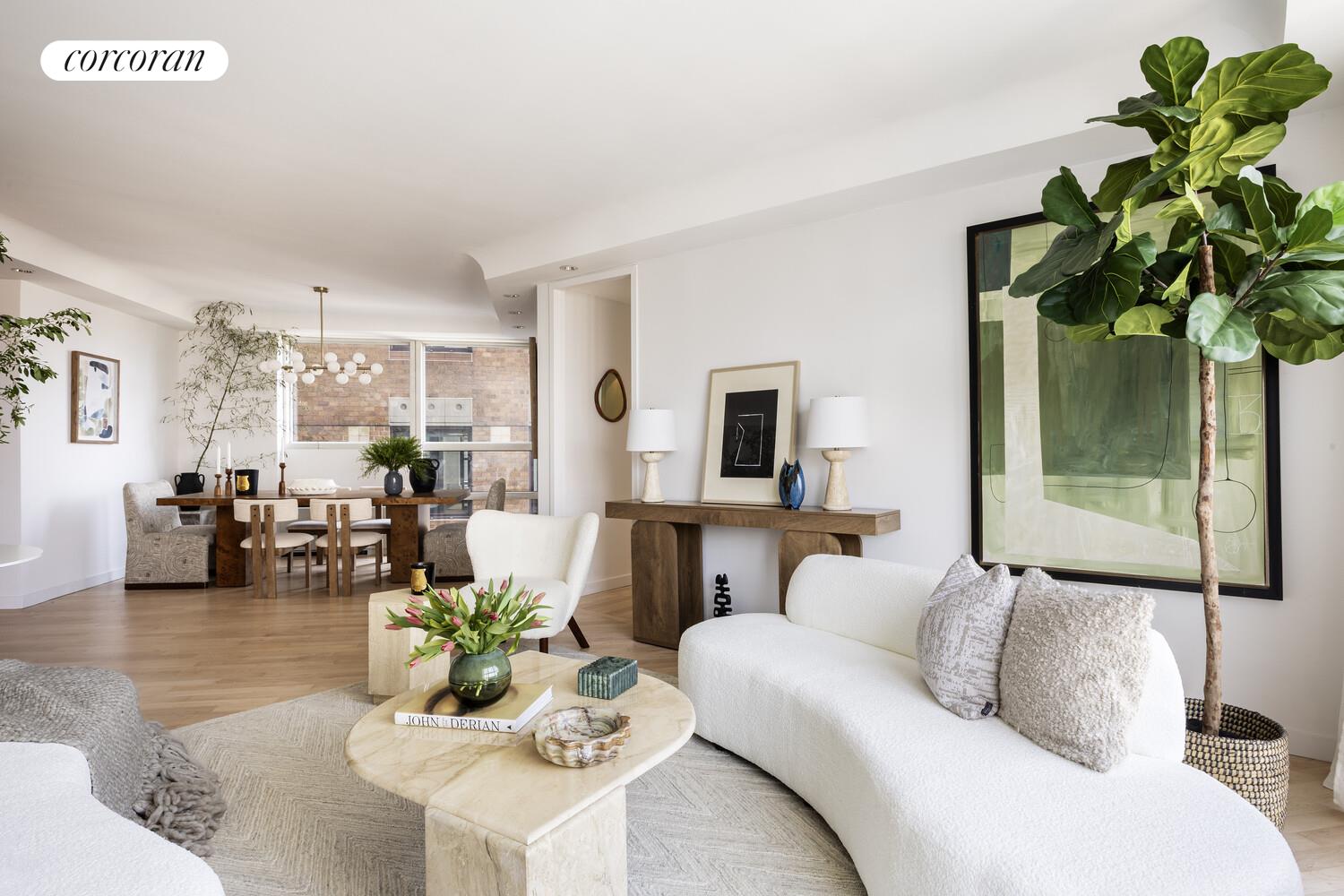 146 West 57th Street, Unit 58A Manhattan, NY 10019 - Photo 4 of 18 a living room with furniture and a potted plant