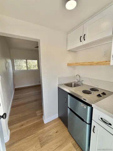 a kitchen with a sink and a stove