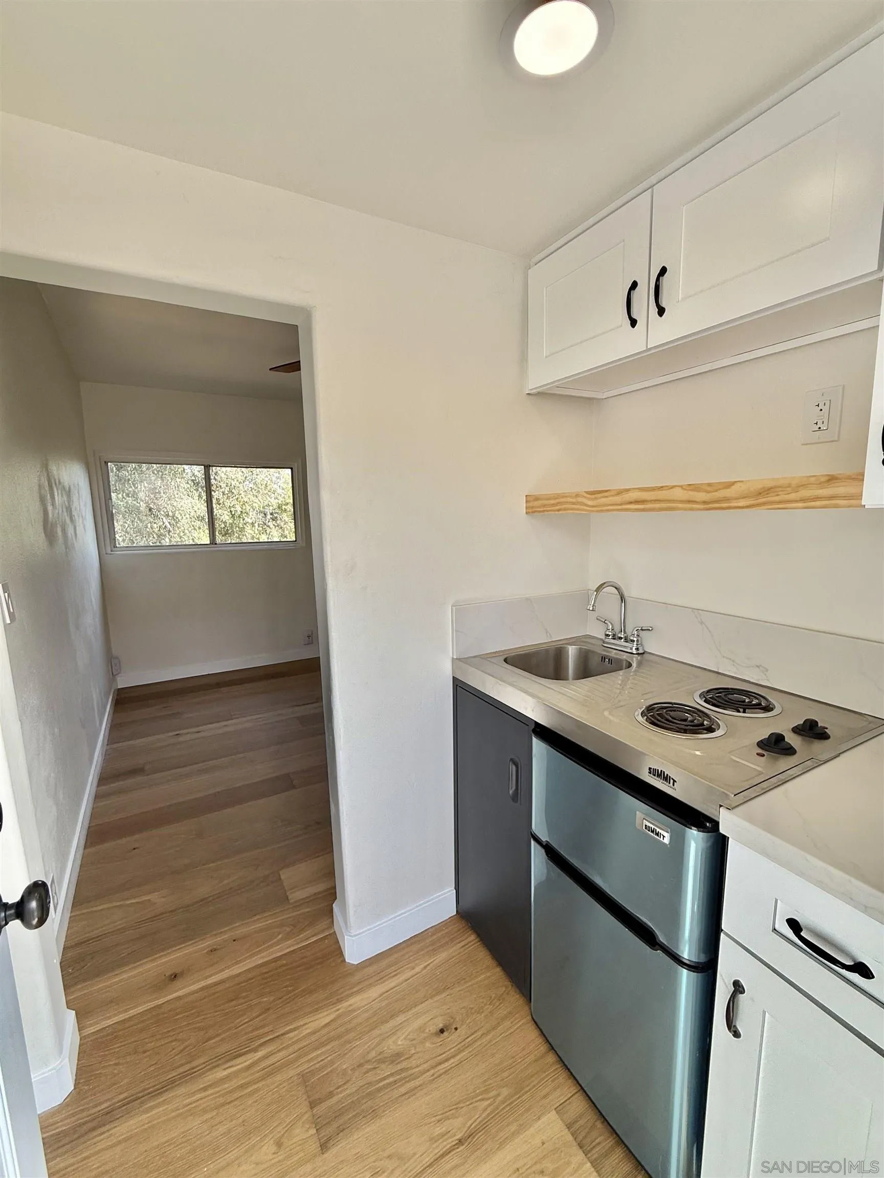 a kitchen with a sink and a stove
