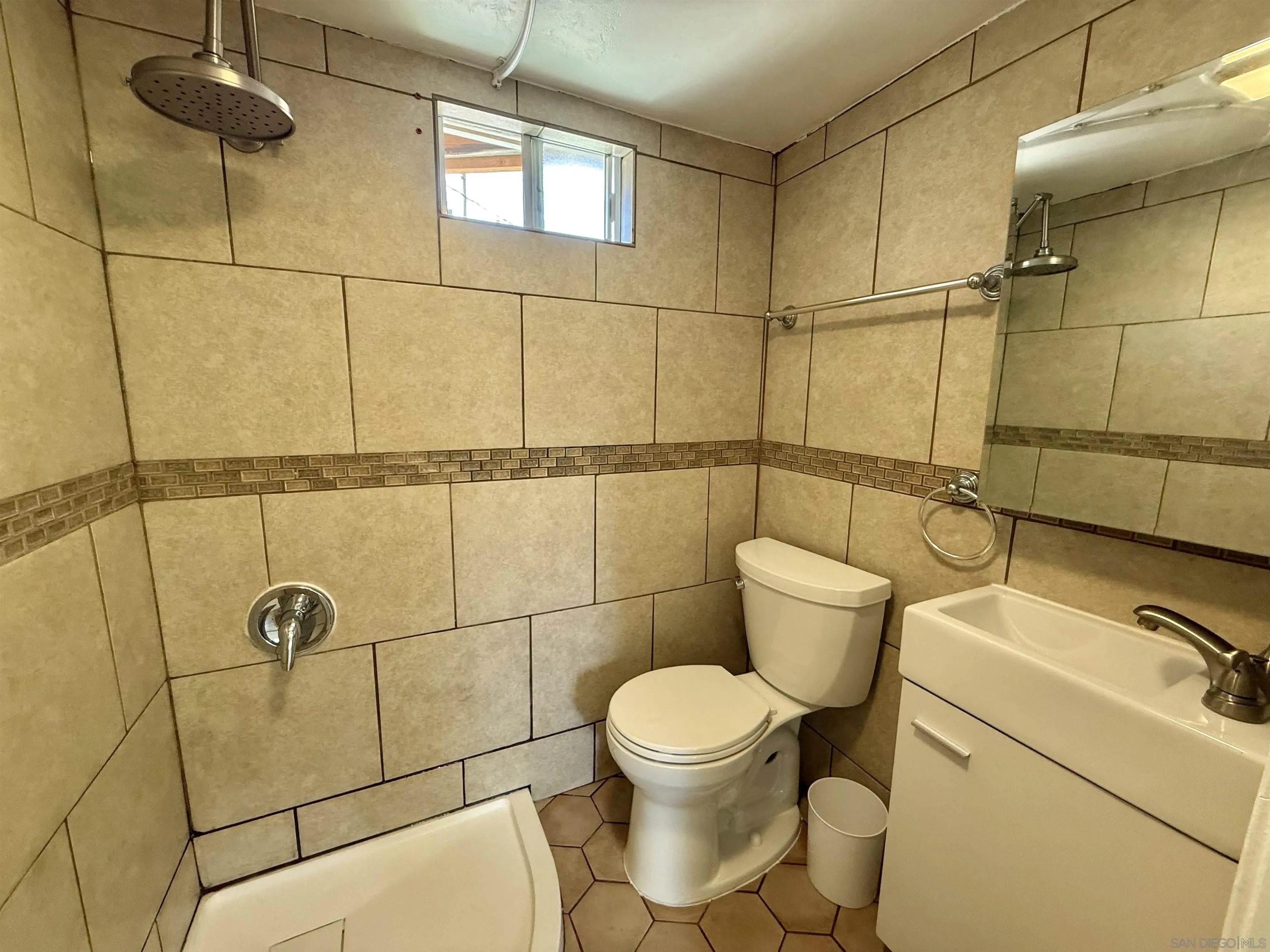 2331 Shamrock Street, Unit STUDIO San Diego, CA 92105 - Photo 7 of 13 a bathroom with a toilet and a shower
