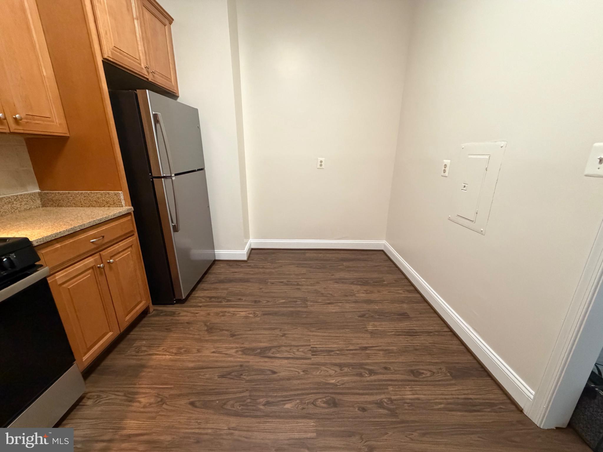 5225 Pooks Hill Road, Unit C29N Bethesda, MD 20814 - Photo 12 of 54 an empty room with wooden floor and a window