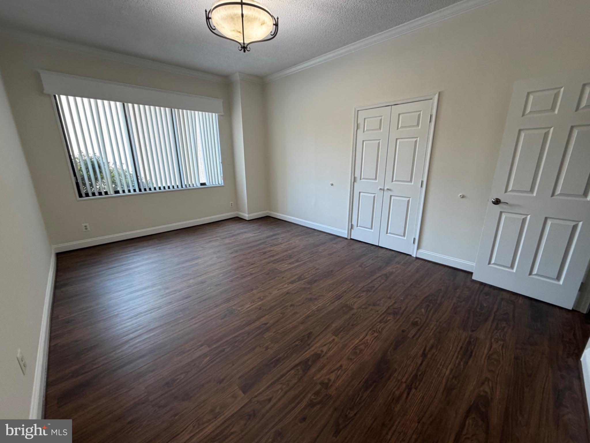 5225 Pooks Hill Road, Unit C29N Bethesda, MD 20814 - Photo 15 of 54 an empty room with wooden floor and windows
