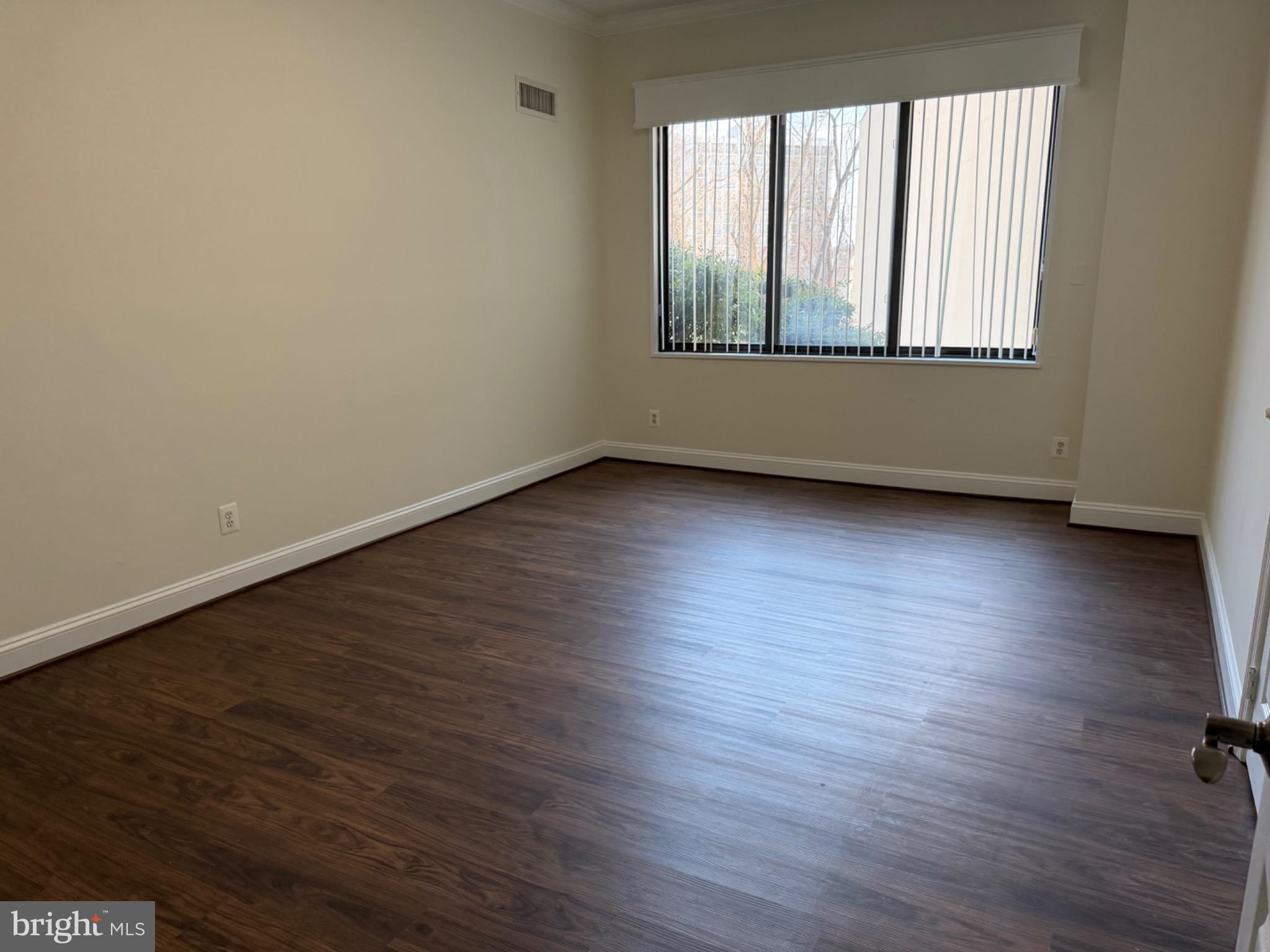 5225 Pooks Hill Road, Unit C29N Bethesda, MD 20814 - Photo 16 of 54 an empty room with wooden floor and windows