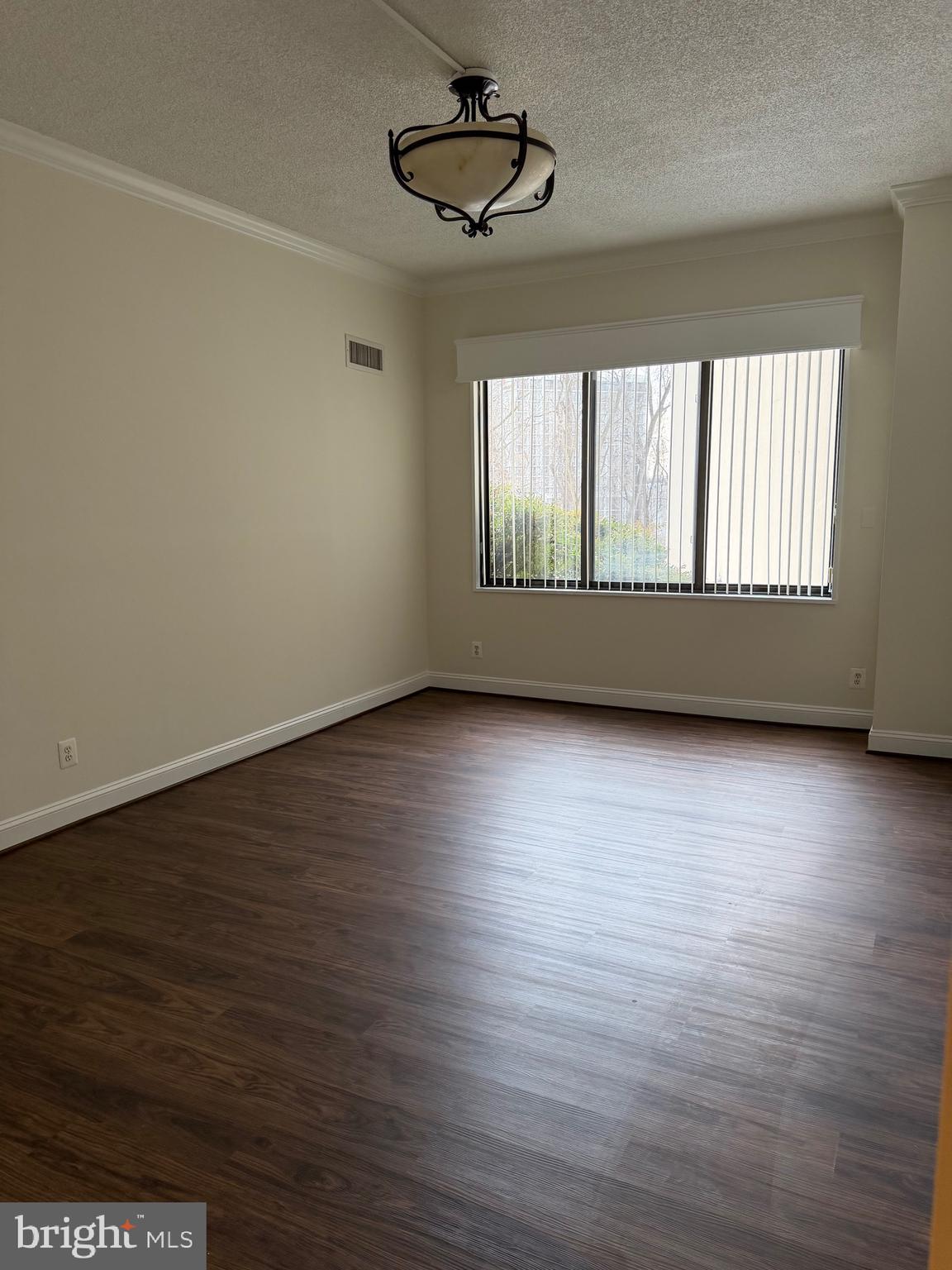 5225 Pooks Hill Road, Unit C29N Bethesda, MD 20814 - Photo 17 of 54 an empty room with wooden floor and windows