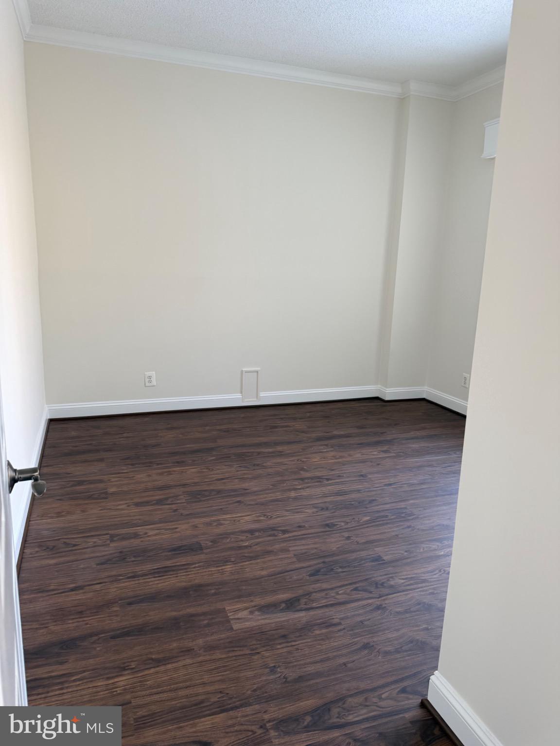 5225 Pooks Hill Road, Unit C29N Bethesda, MD 20814 - Photo 23 of 54 a view of an empty room with wooden floor