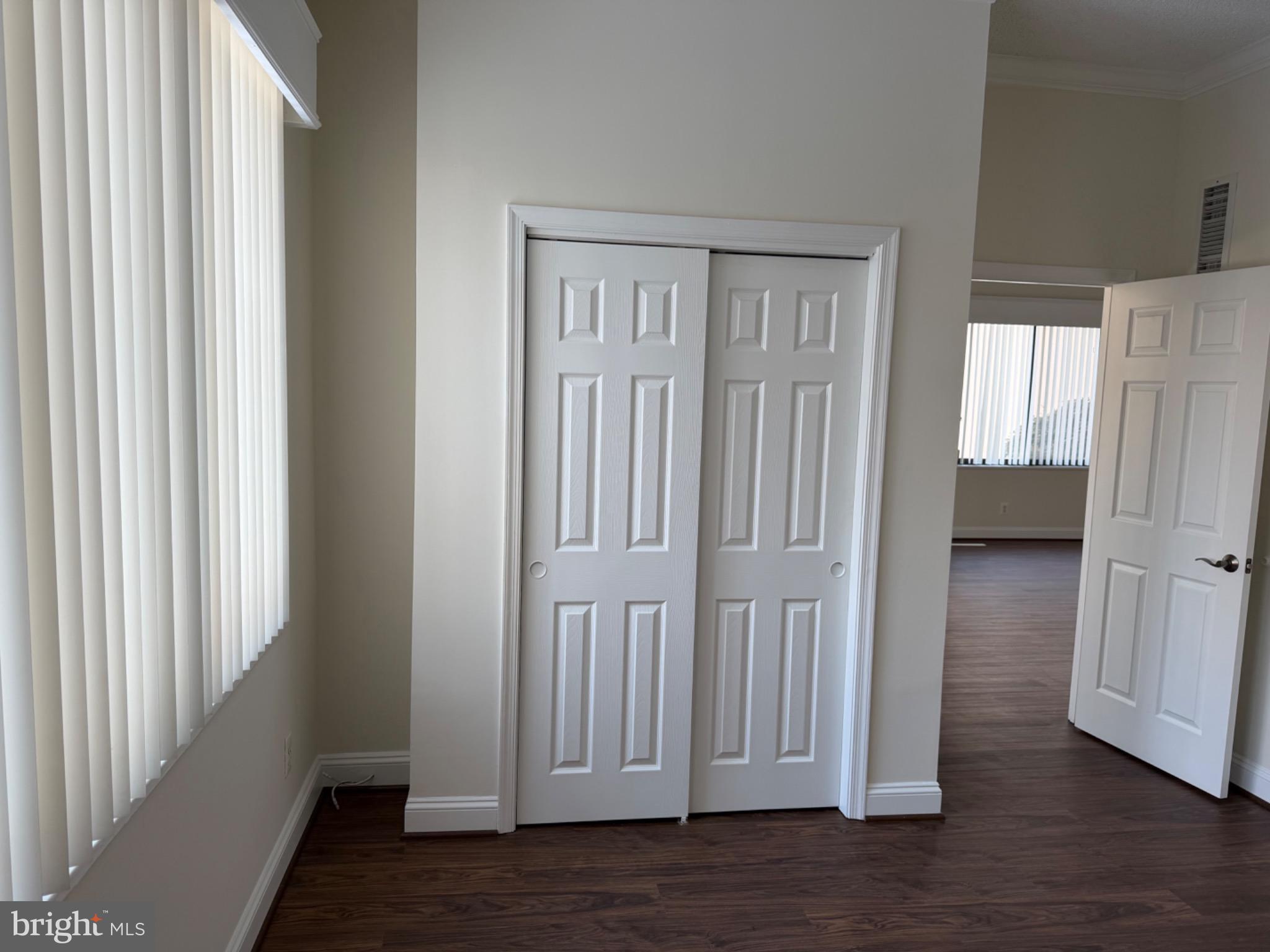 5225 Pooks Hill Road, Unit C29N Bethesda, MD 20814 - Photo 24 of 54 an empty room with wooden floor and windows