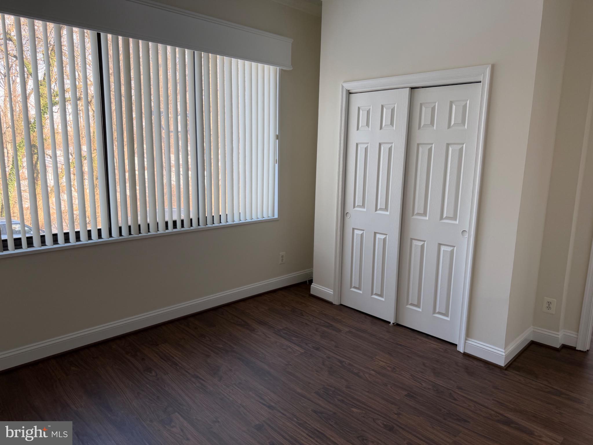 5225 Pooks Hill Road, Unit C29N Bethesda, MD 20814 - Photo 25 of 54 an empty room with wooden floor and windows