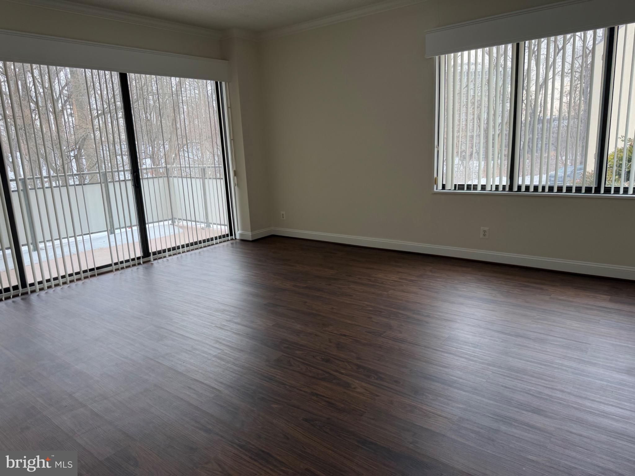 5225 Pooks Hill Road, Unit C29N Bethesda, MD 20814 - Photo 9 of 54 an empty room with wooden floor and windows