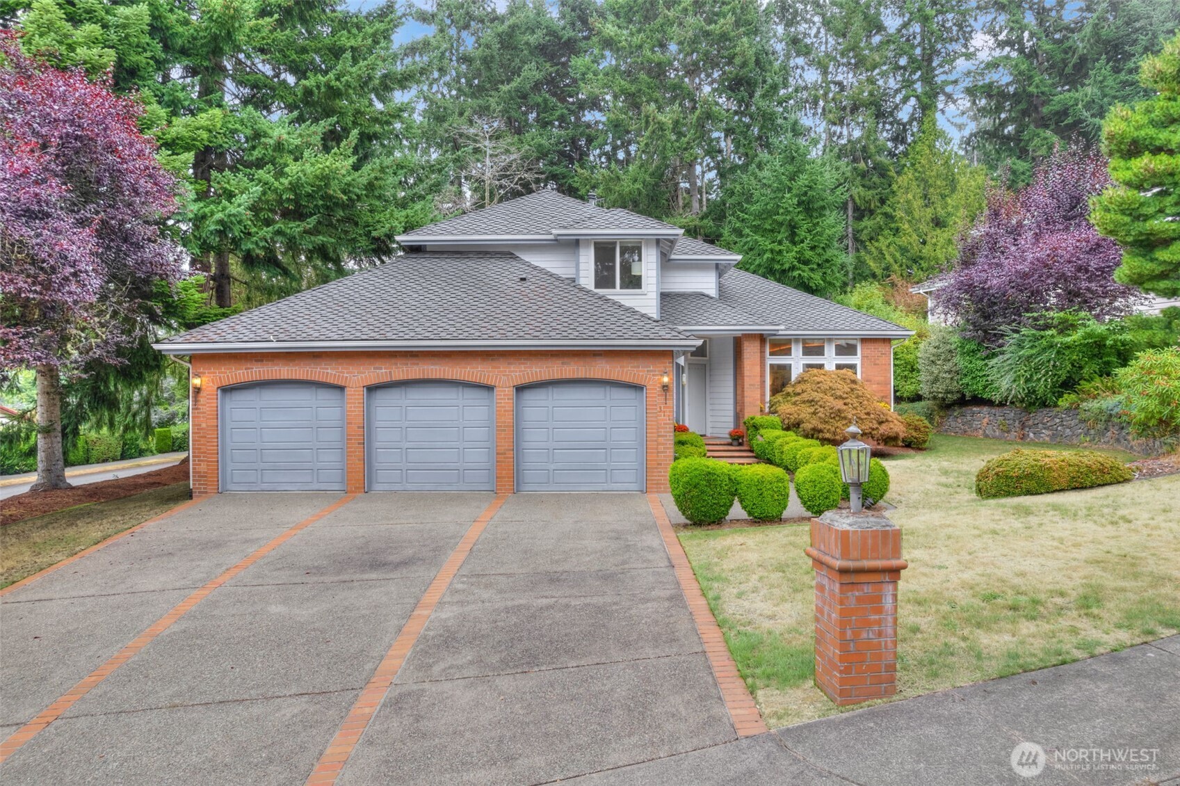 311 Keach Loop Steilacoom, WA 98388 - Photo 1 of 38 a front view of a house with garden