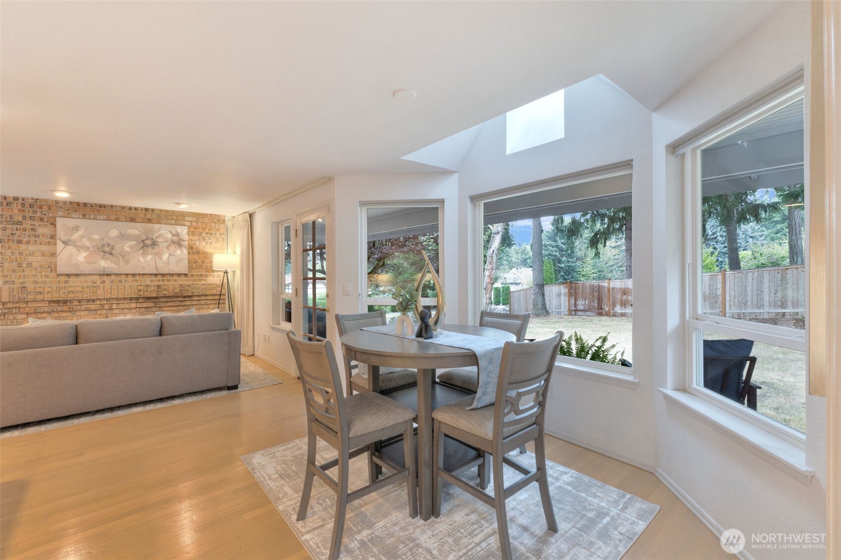 311 Keach Loop Steilacoom, WA 98388 - Photo 12 of 38 a dining room with furniture and a floor to ceiling window