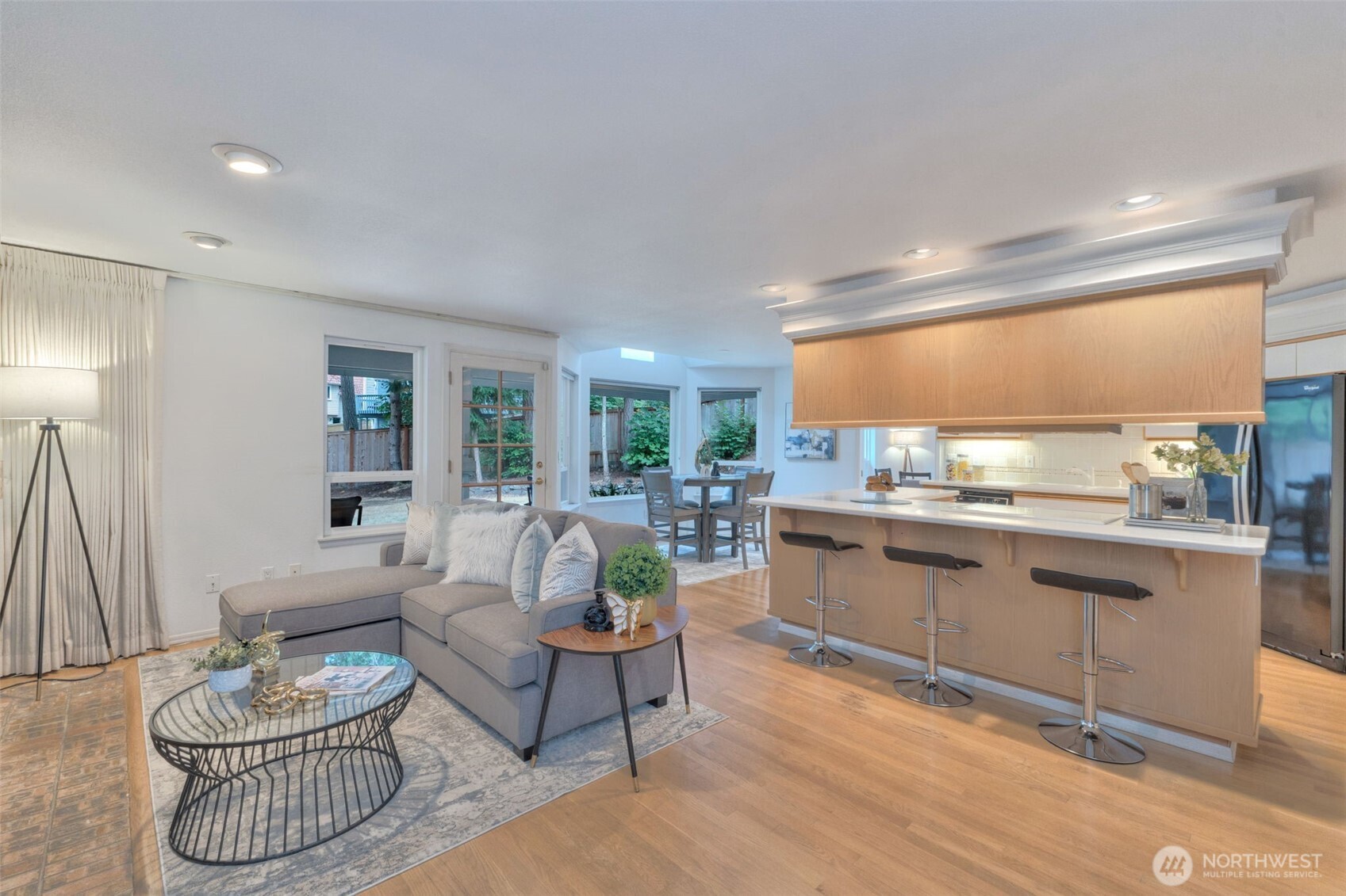 311 Keach Loop Steilacoom, WA 98388 - Photo 18 of 38 a kitchen with a sink and living room