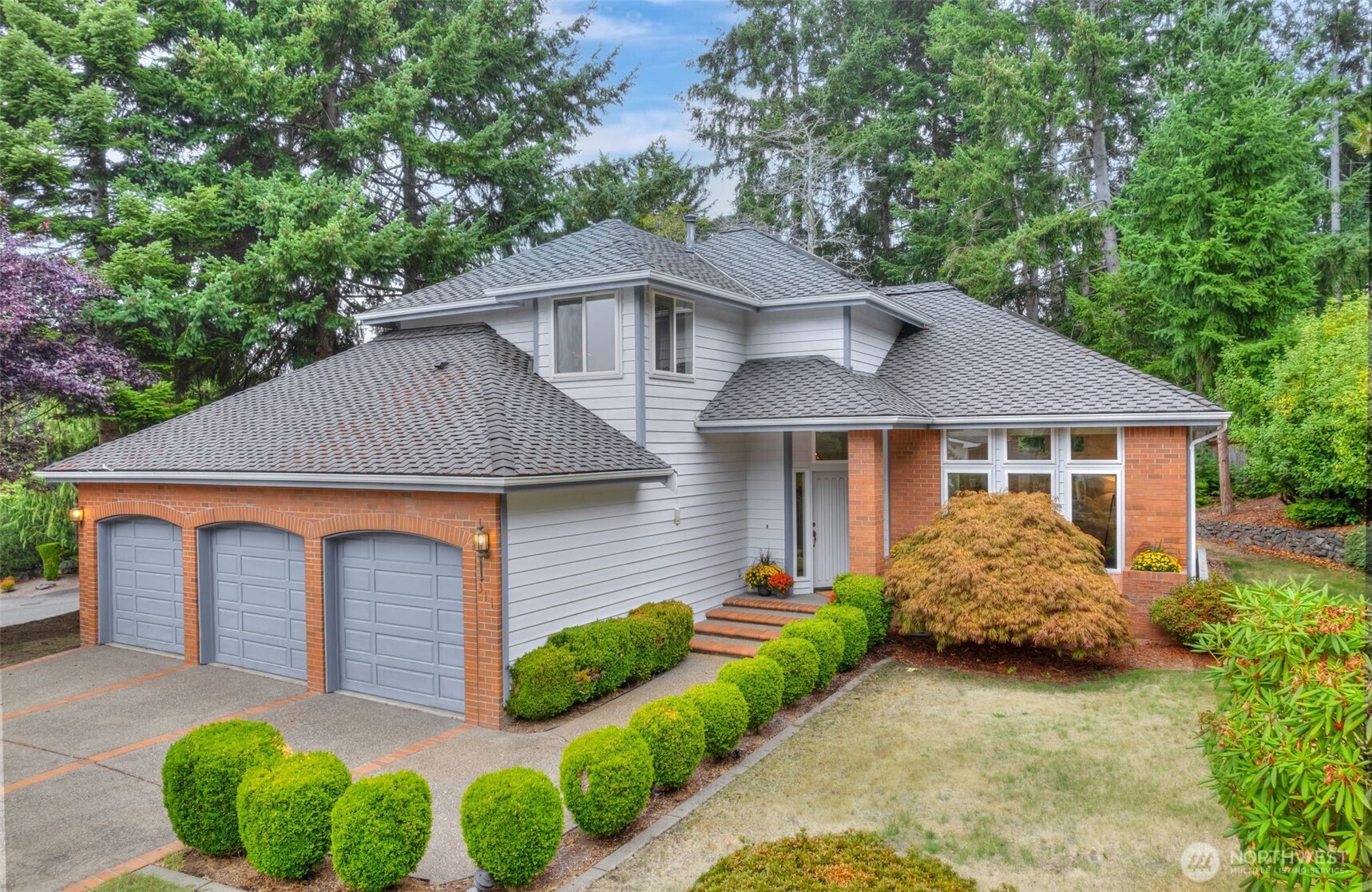 311 Keach Loop Steilacoom, WA 98388 - Photo 2 of 38 a front view of a house with garden