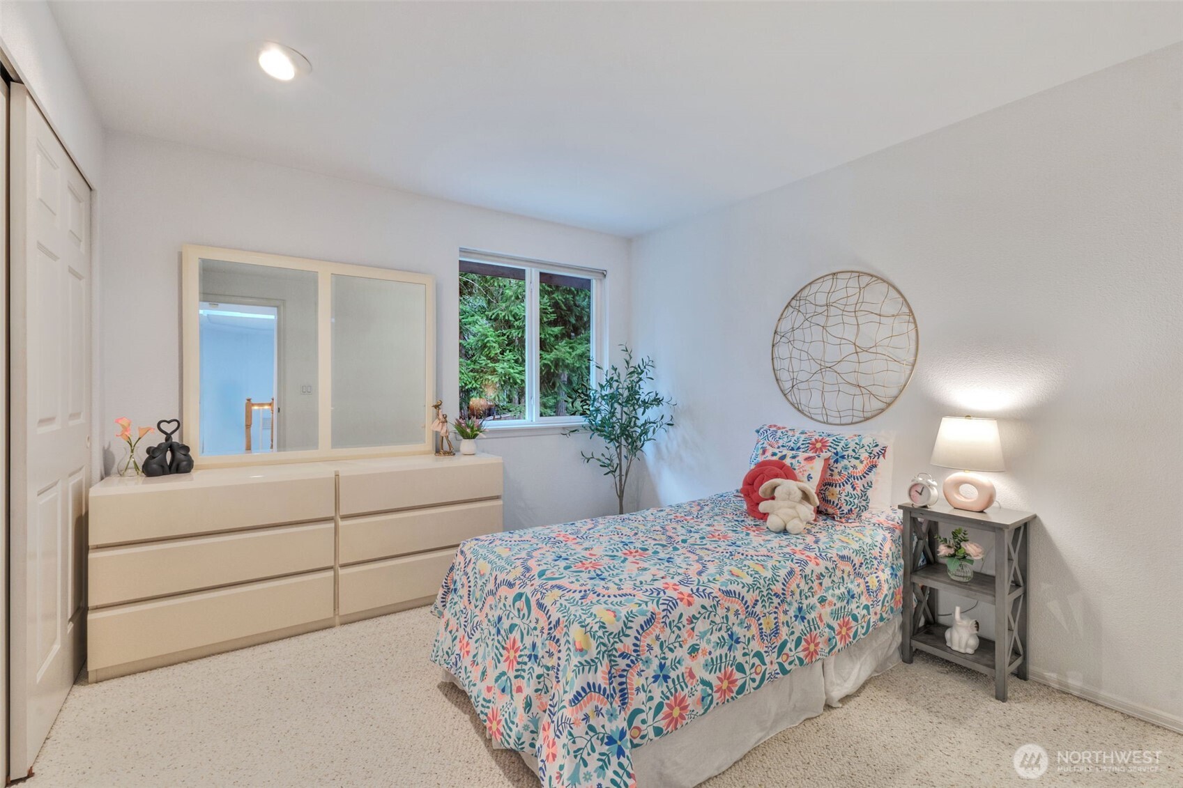 311 Keach Loop Steilacoom, WA 98388 - Photo 23 of 38 a bed room with a bed mirror and a window