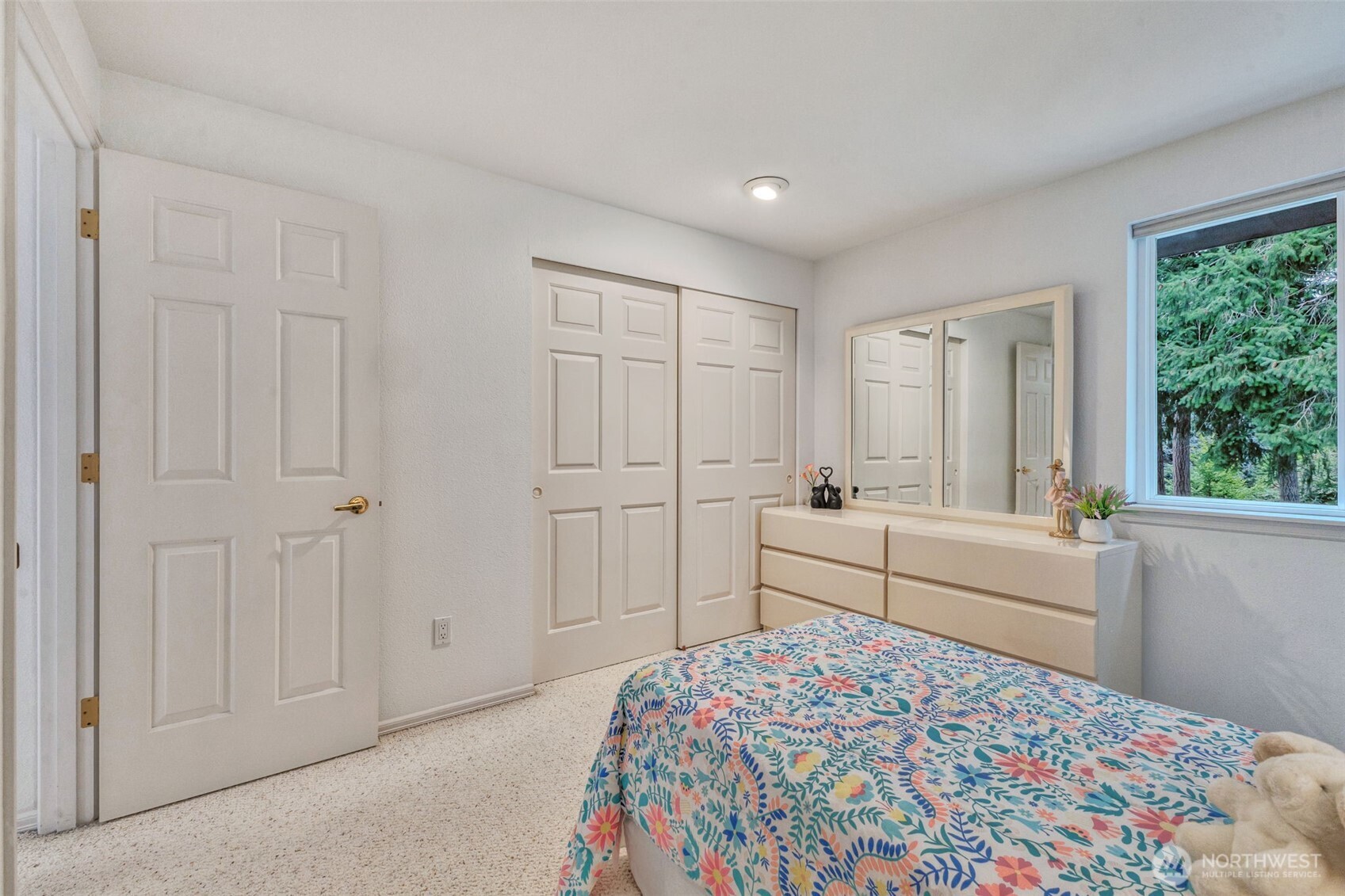 311 Keach Loop Steilacoom, WA 98388 - Photo 24 of 38 a bedroom with a bed and a window