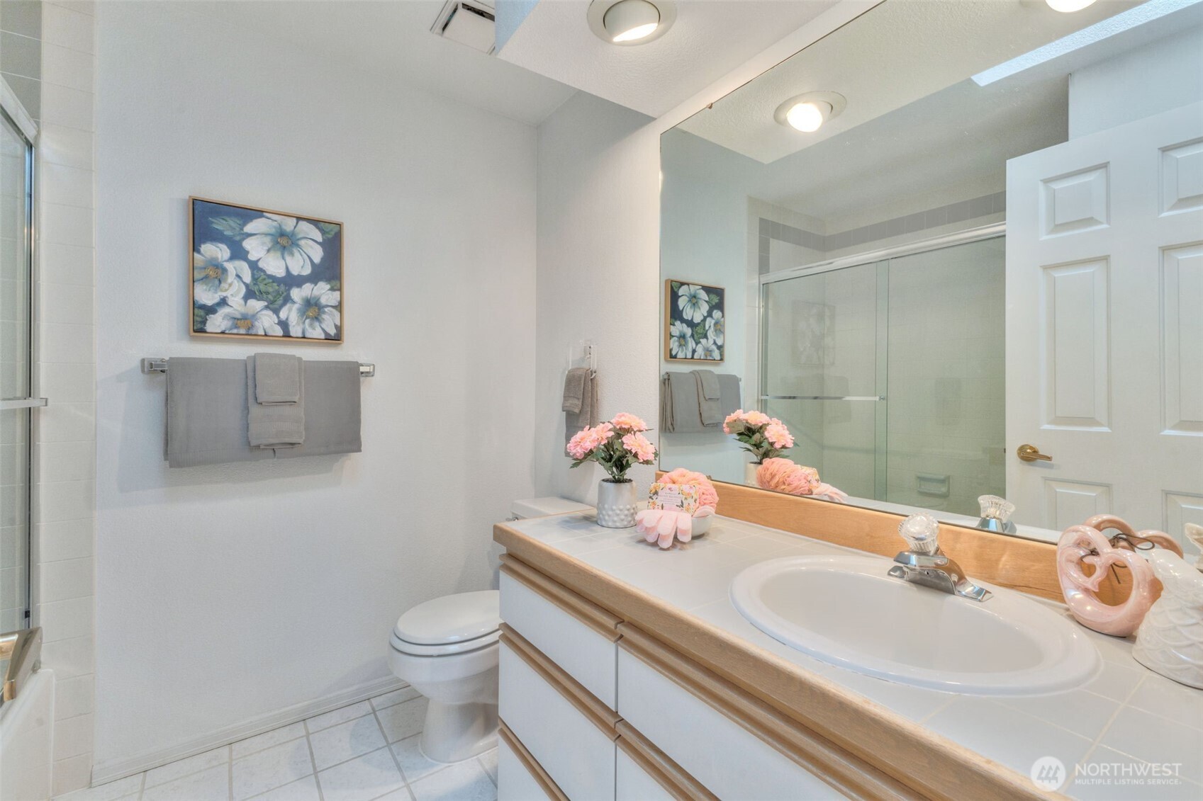 311 Keach Loop Steilacoom, WA 98388 - Photo 26 of 38 a bathroom with a sink and a mirror